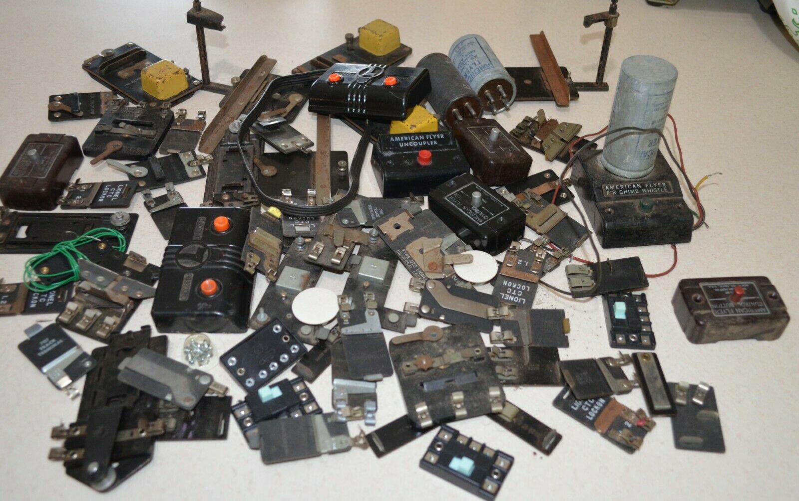 HUGE lot of Lionel and American flyer buttons, contacts, and do-dads!